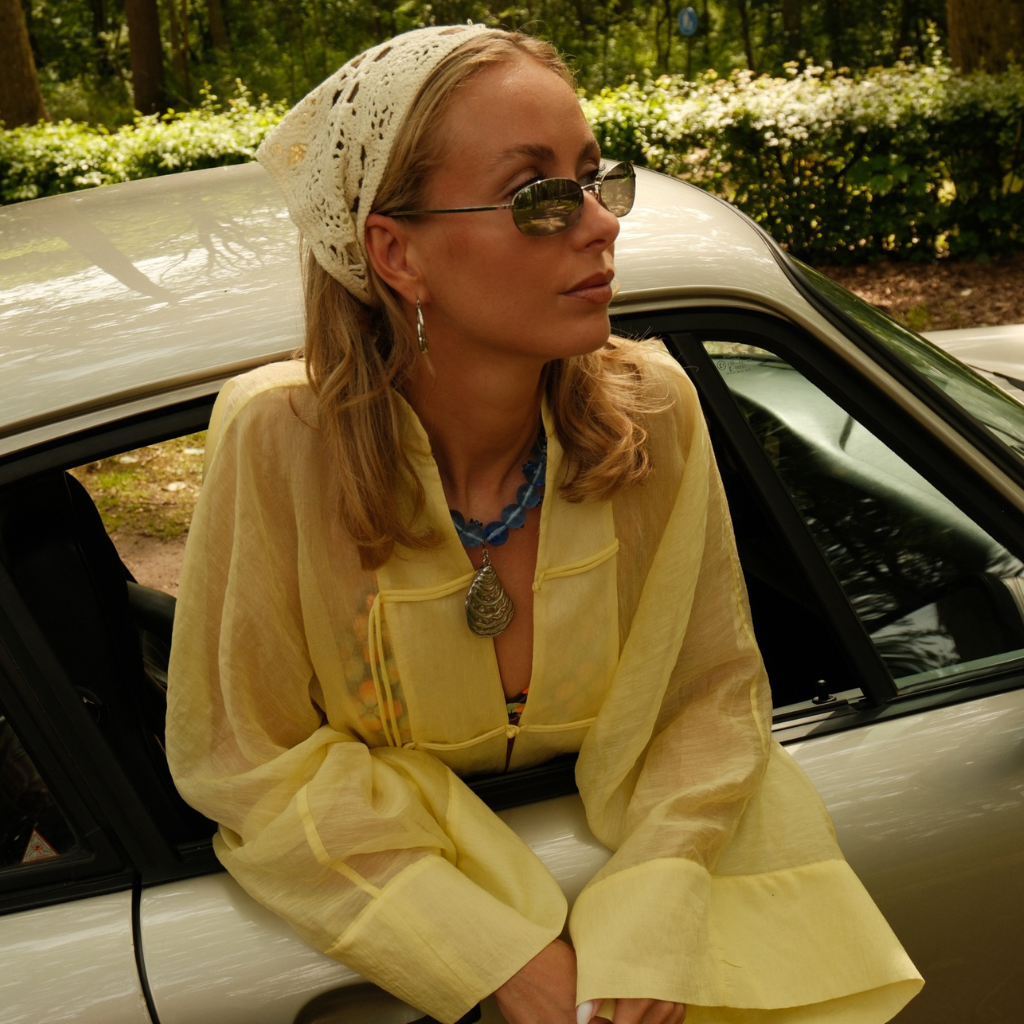 Model wearing the Ostra Pendant Silver on a silver necklace.