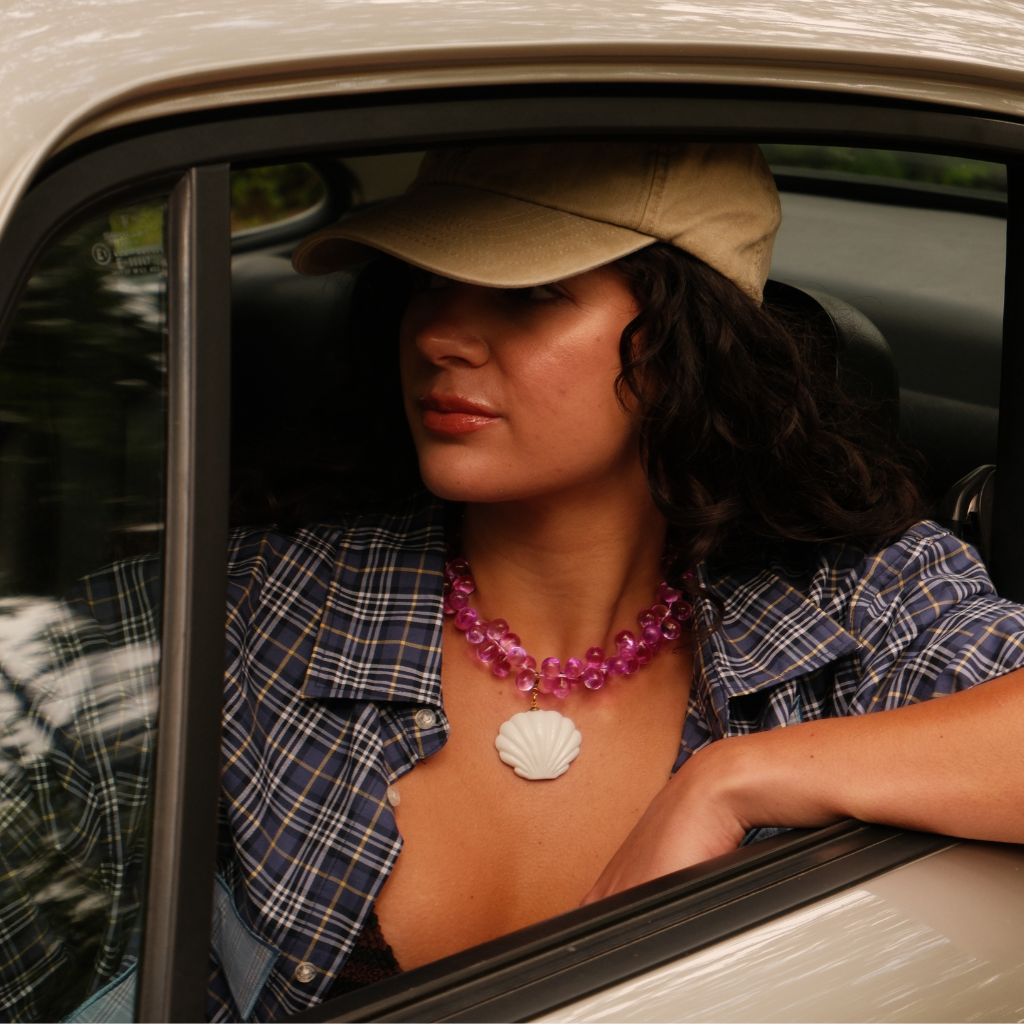 Model wearing the Mermaid 2.0 Pendant on a summery necklace. 